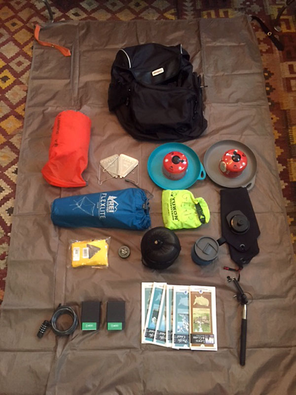 Contents of my left rear pannier. My camping gear with REI Flex Lite Chair and other important items.