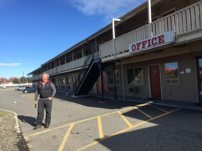 Hugh standing in front of the Econo Lodge in Kennewick, Washington